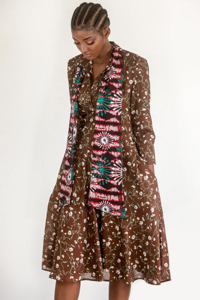 Flared dress that works for the office and for a wedding.  The Chocolate floral print dress is joined with a rich African wax print in ruby, green and pink as a generous scarf or tie